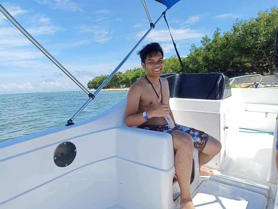 Ingvar relaxing on a boat during a sunny trip