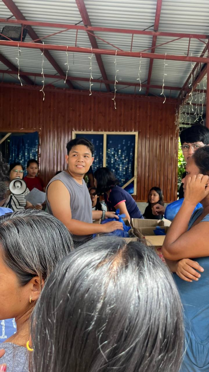 Ingvar helping at a community gathering